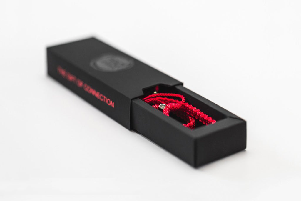 Madovar black rigid sleeve box with printing for Redstring